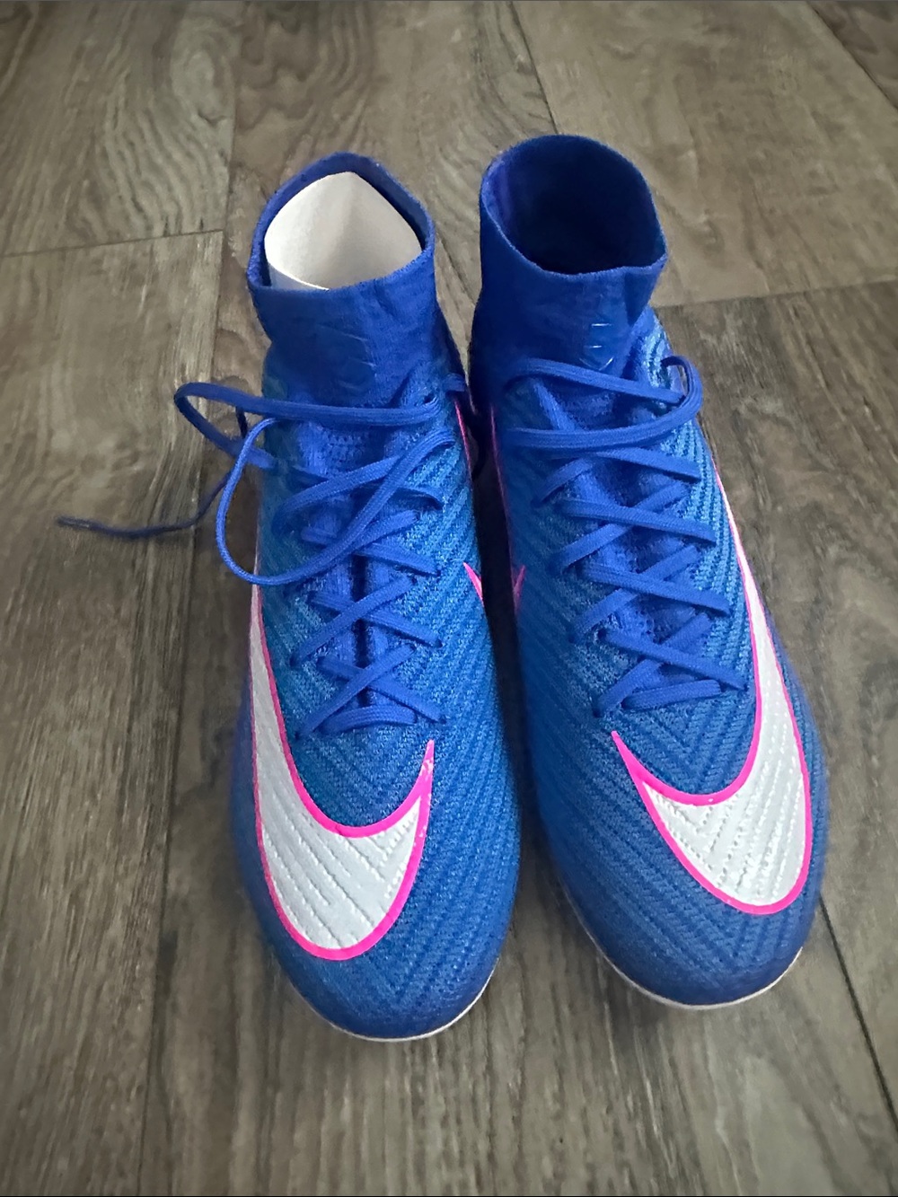 Nike men’s Blue High-Top Soccer Cleats with Pink-Trimmed White Swoosh